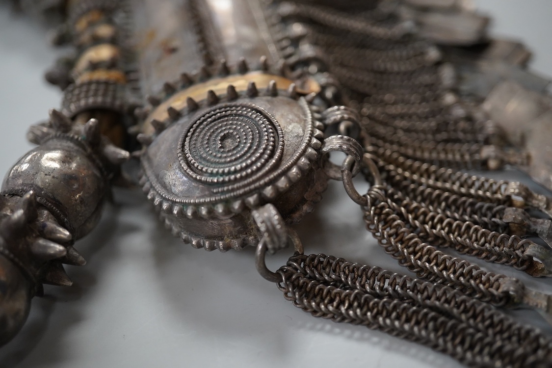 A Bedouin white metal and coral mounted necklace, from Oman, 58cm long